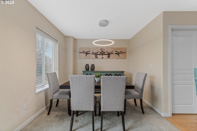 dining room featuring baseboards