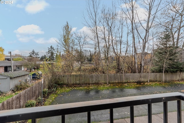 property view of water with fence private yard