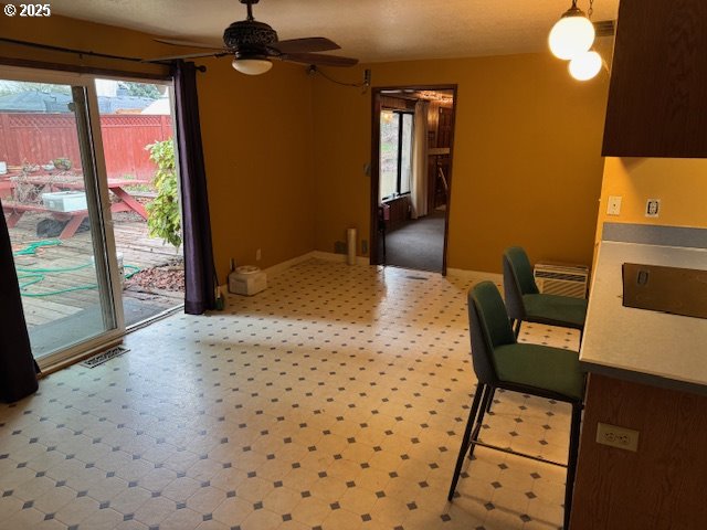 dining space with ceiling fan