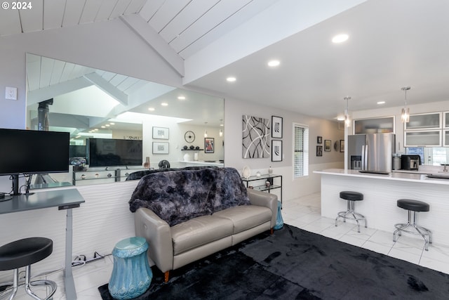 living room featuring lofted ceiling