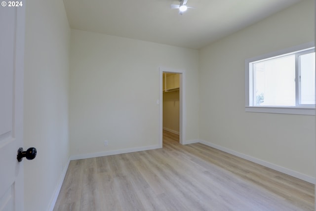 spare room with light wood-type flooring