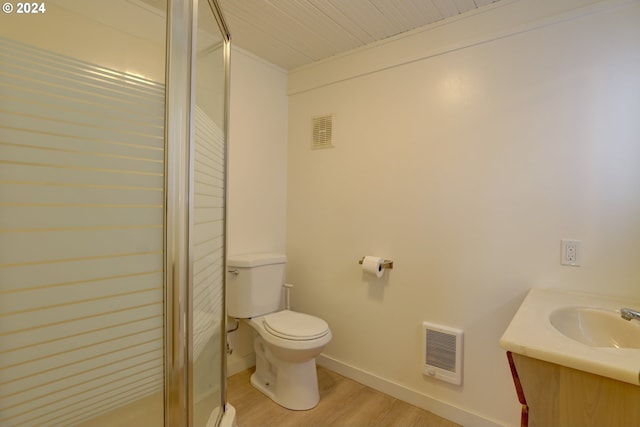 bathroom with vanity, hardwood / wood-style flooring, and toilet