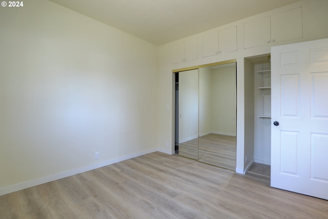 unfurnished bedroom featuring light hardwood / wood-style floors