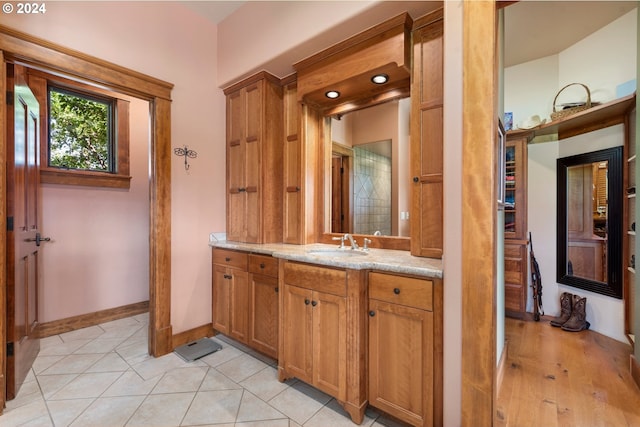 bathroom featuring tile patterned floors and vanity