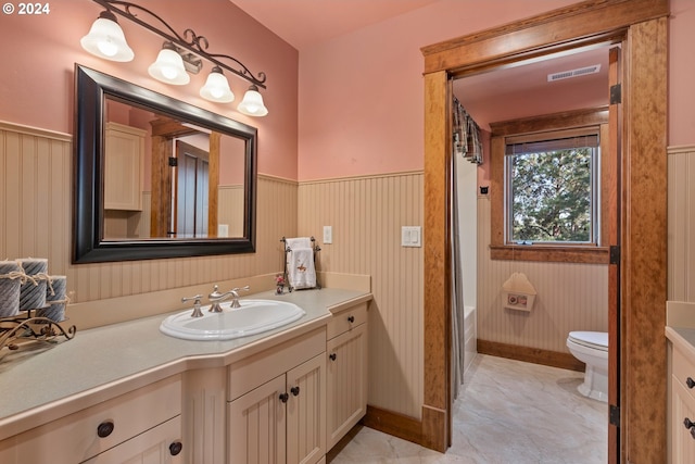 bathroom with vanity and toilet