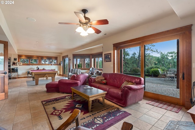 living room with pool table, ceiling fan, and light tile patterned flooring