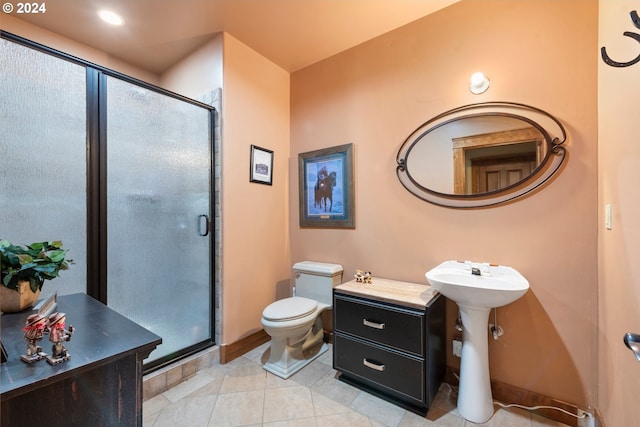 bathroom with tile patterned floors, an enclosed shower, and toilet