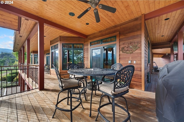 exterior space with ceiling fan and a grill