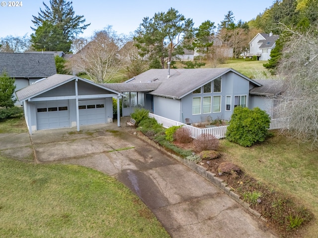 ranch-style home with a front lawn