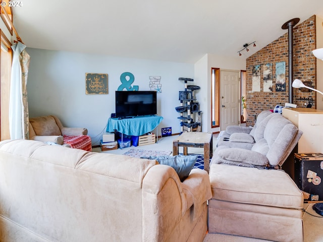 living room featuring carpet, brick wall, and vaulted ceiling