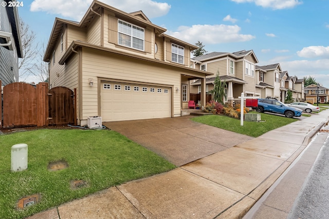 view of front of property featuring a garage and a front lawn