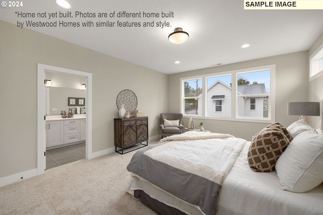 carpeted bedroom with ensuite bath