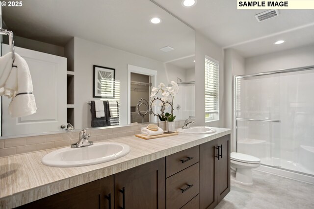 2236 Ash St Unit 21, Woodland, WA 98674 - bathroom with a shower stall, double vanity, toilet, and recessed lighting