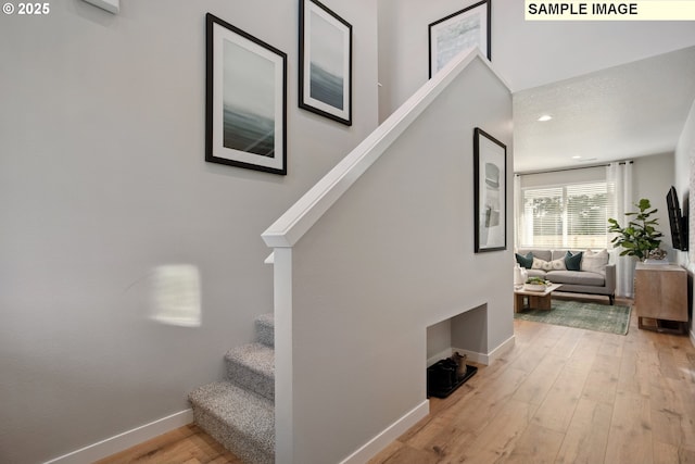 2236 Ash St Unit 21, Woodland, WA 98674 - staircase with baseboards, wood-type flooring, and recessed lighting