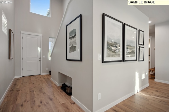2236 Ash St Unit 21, Woodland, WA 98674 - foyer entrance with wood finished floors, baseboards, and a towering ceiling