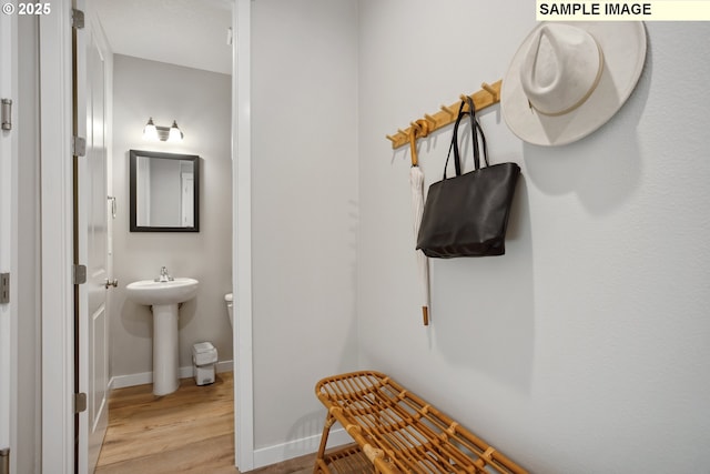 2236 Ash St Unit 21, Woodland, WA 98674 - bathroom featuring wood finished floors, a sink, and baseboards