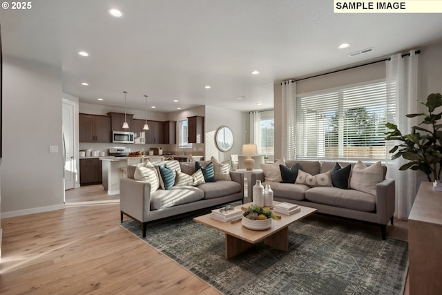2236 Ash St Unit 21, Woodland, WA 98674 - living room featuring light wood finished floors, recessed lighting, and baseboards