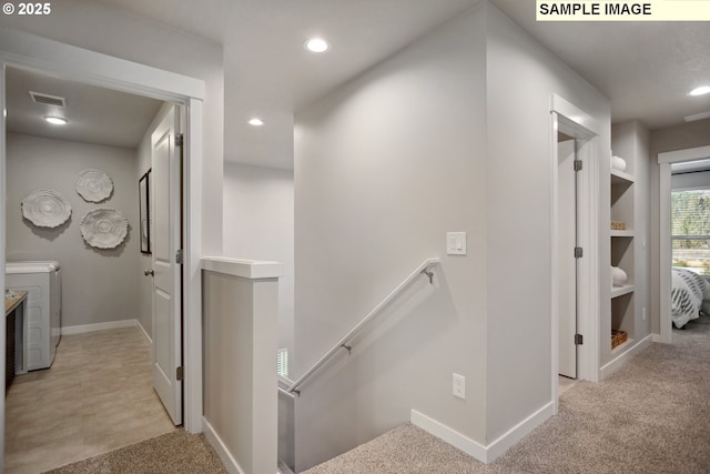 2236 Ash St Unit 21, Woodland, WA 98674 - hallway with an upstairs landing, washer and clothes dryer, light carpet, recessed lighting, and baseboards