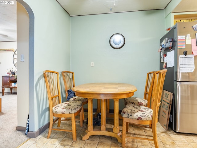 dining space with light carpet