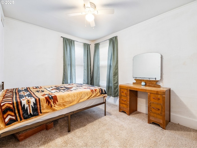 bedroom with light colored carpet, ceiling fan, and ornamental molding