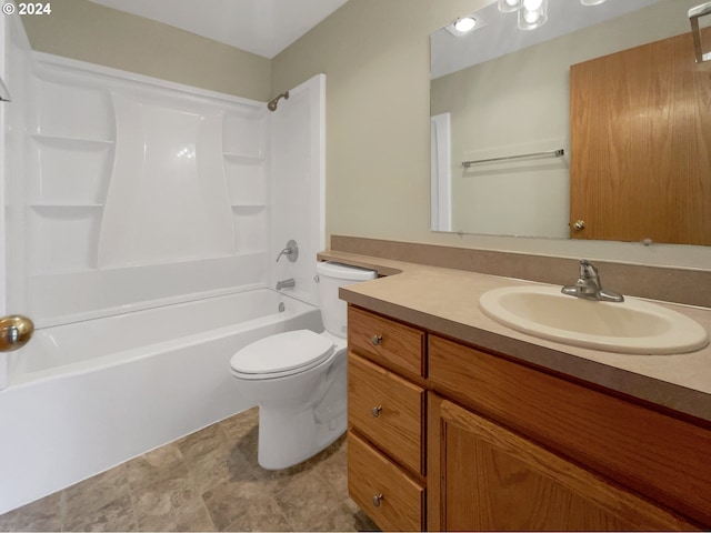 full bathroom featuring tub / shower combination, vanity, and toilet