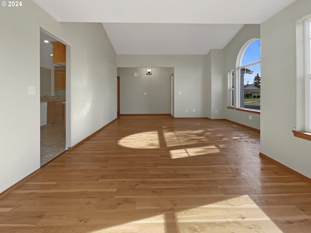 unfurnished room featuring hardwood / wood-style flooring