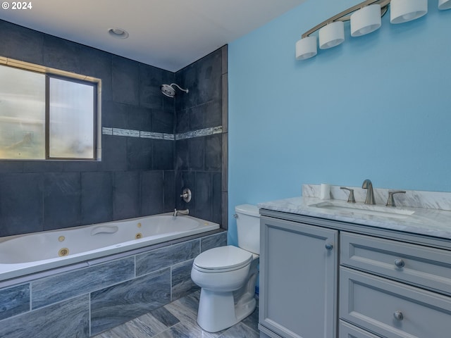 full bathroom with vanity, tiled shower / bath combo, toilet, and tile patterned floors