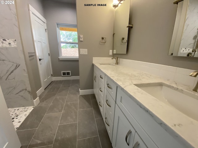 bathroom with vanity and tile patterned floors