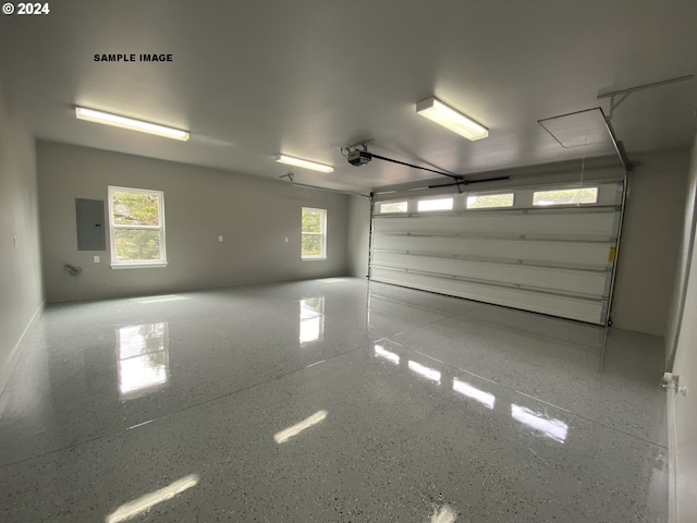 garage featuring electric panel and a garage door opener