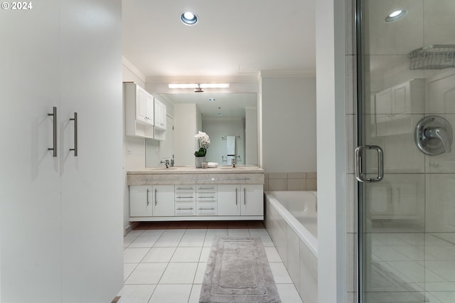 bathroom featuring tile patterned flooring, vanity, crown molding, and shower with separate bathtub