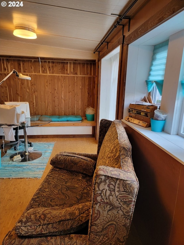 sitting room with wood walls