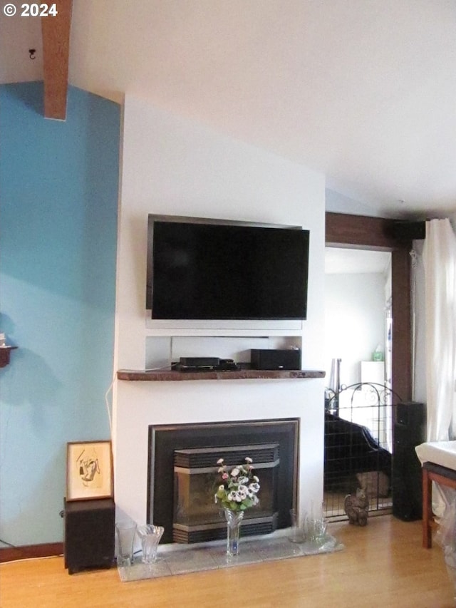 room details with beam ceiling and wood-type flooring