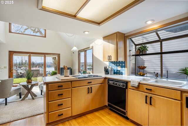 kitchen with backsplash, black fridge with ice dispenser, and light brown cabinets