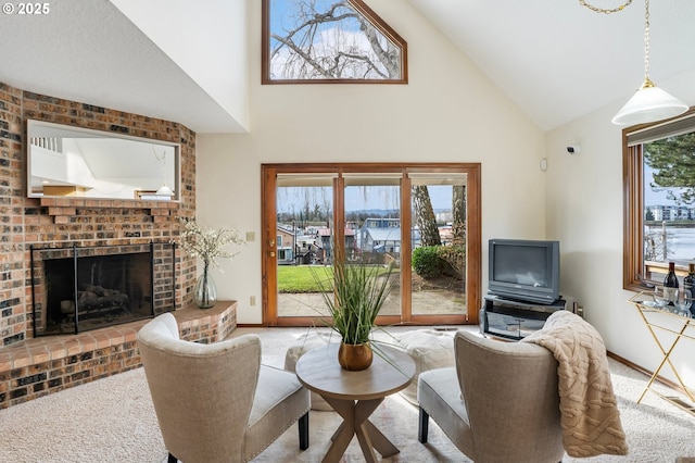 living room with a fireplace, high vaulted ceiling, and light colored carpet