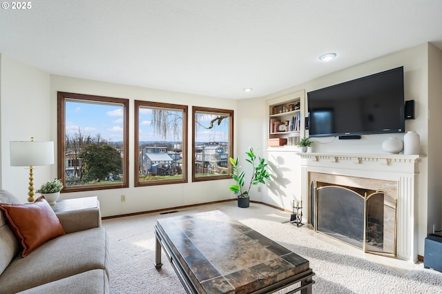 carpeted living room with built in shelves