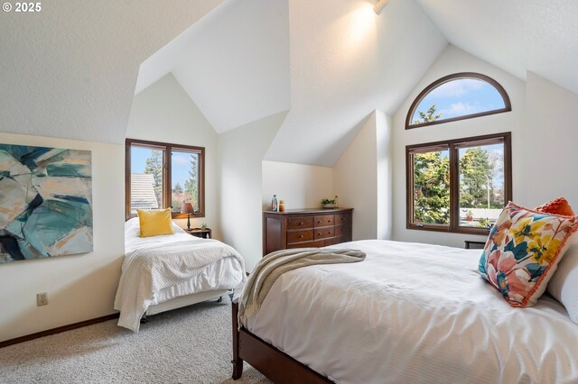 bedroom with light carpet and lofted ceiling