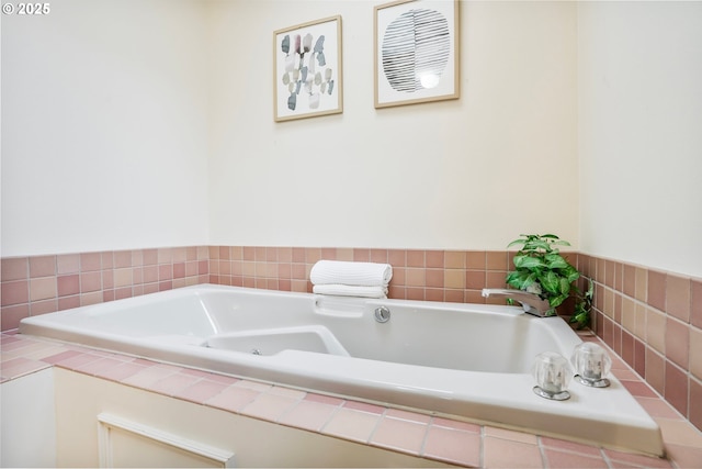 bathroom with a relaxing tiled tub