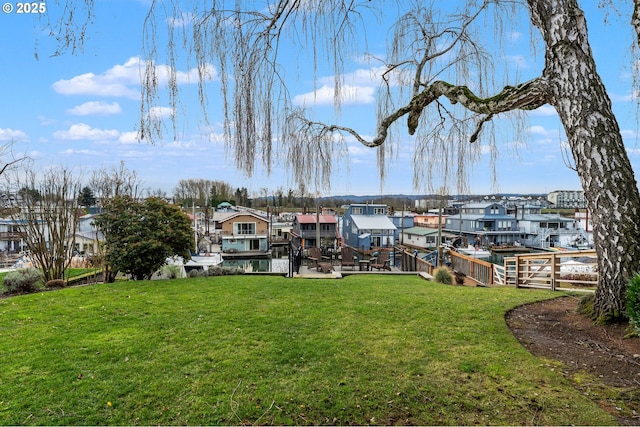 view of dock with a lawn