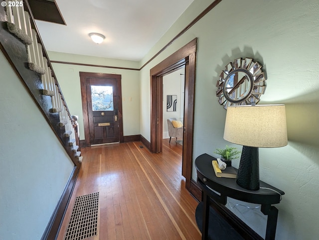 foyer entrance with dark wood-type flooring