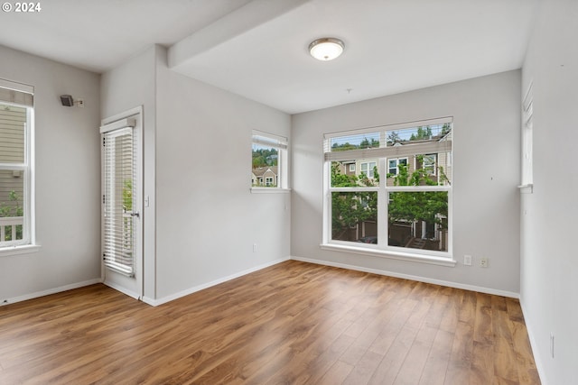 unfurnished room featuring wood-type flooring