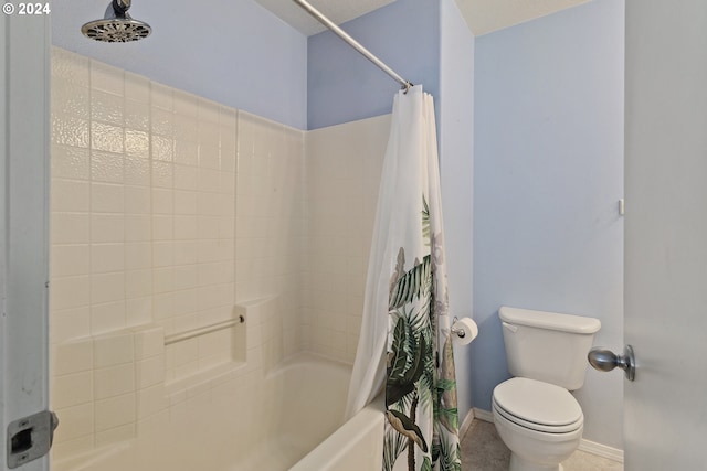 bathroom featuring shower / bath combination with curtain and toilet