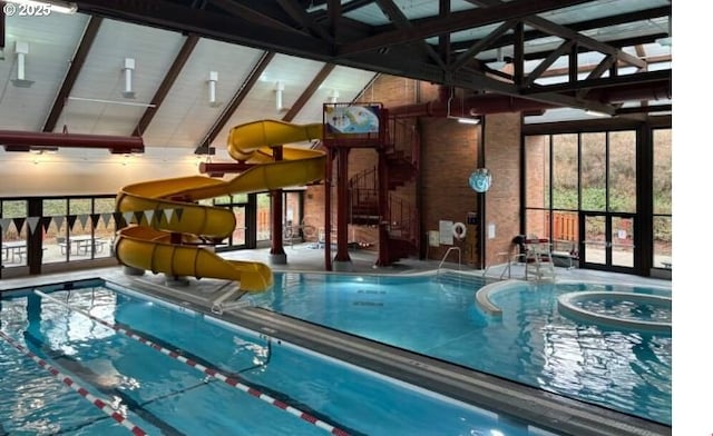 view of pool featuring a water slide and a lanai