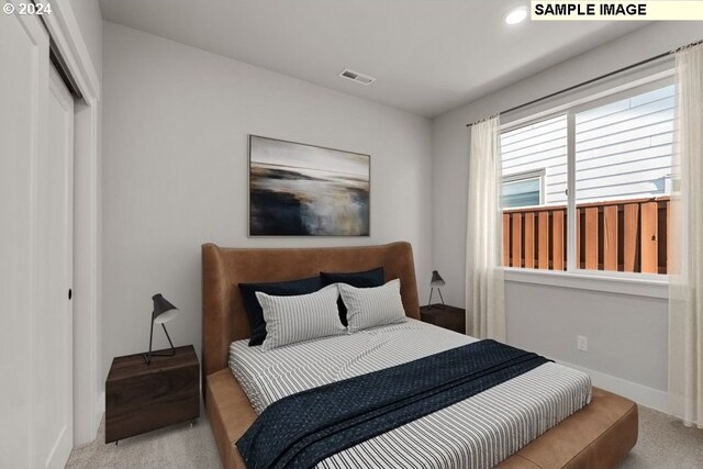 carpeted bedroom with a closet