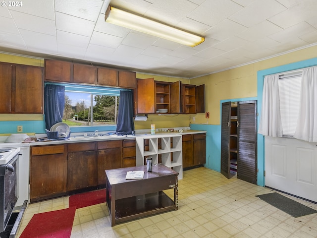 121 Jones Rd, Pe Ell, WA 98572 - kitchen featuring electric range oven, sink, and light tile floors