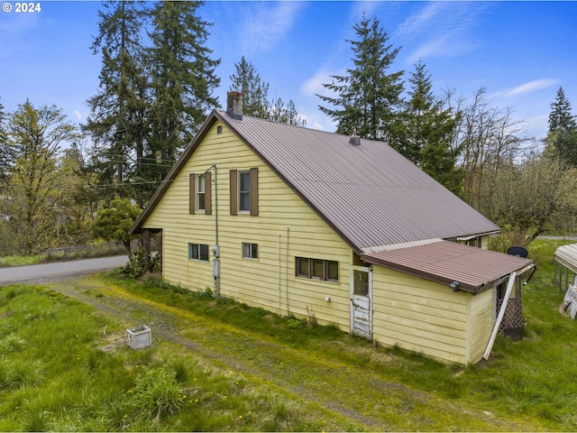 121 Jones Rd, Pe Ell, WA 98572 - view of side of home with a lawn