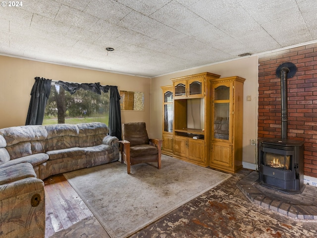 121 Jones Rd, Pe Ell, WA 98572 - living room with a wood stove, dark wood-type flooring, and crown molding