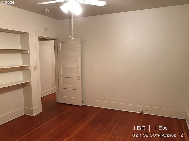 unfurnished bedroom featuring ceiling fan, a closet, and dark wood-type flooring