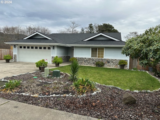 ranch-style house featuring a garage and a front yard