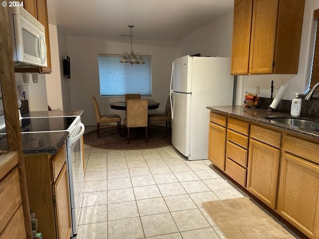 kitchen featuring sink, a notable chandelier, decorative light fixtures, white appliances, and light tile patterned flooring