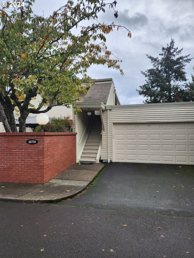 view of front of property featuring driveway and an attached garage